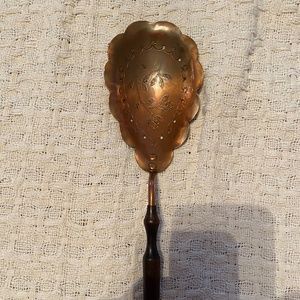 Antique, European, copper serving spoon.
